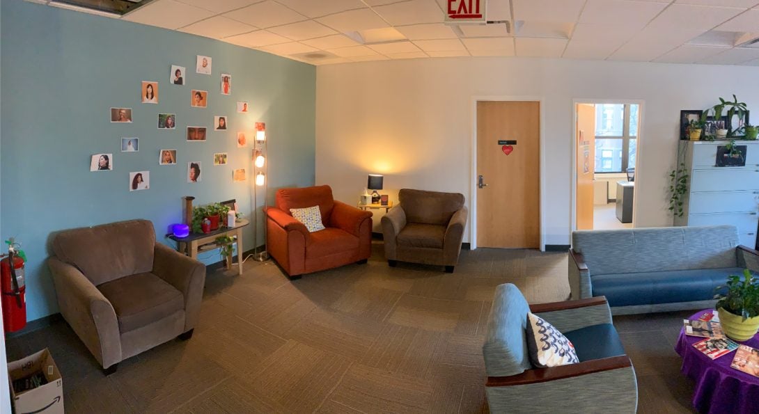 Lounge area of WLRC with comfortable chairs and couches and dim lighting