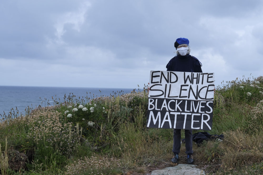 Climate change activists from Extinction Rebellion standing in solidarity with worldwide Black Lives Matter protests following the death of George Floyd, Sunday June 7, 2020 in St Ives, United Kingdom. (Gav Goulder/In Pictures via Getty Images)