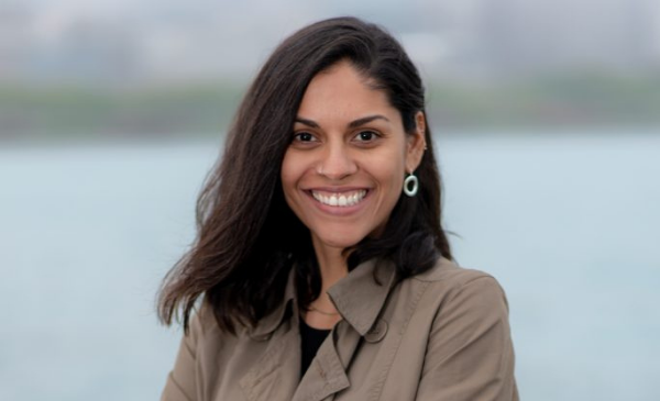 Priscila Pereira smiles at the camera