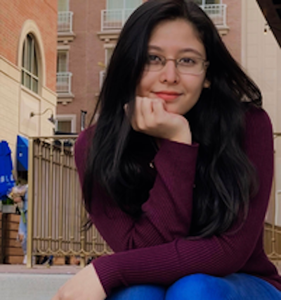 Paola Castro smiling toward the camera