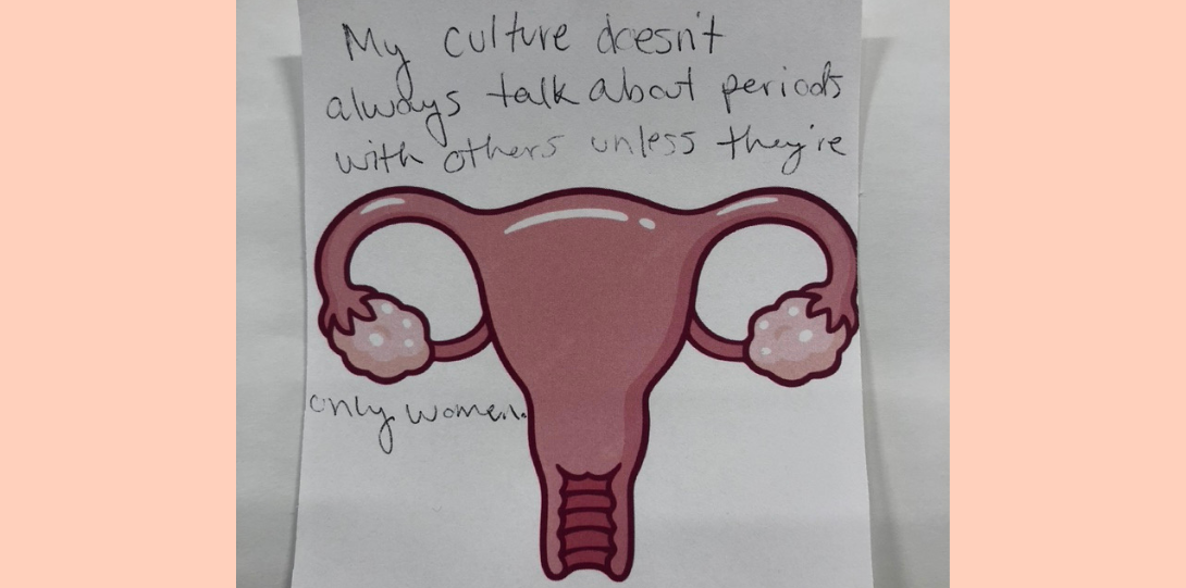 A sticky note with a pink uterus and written text that reads, 