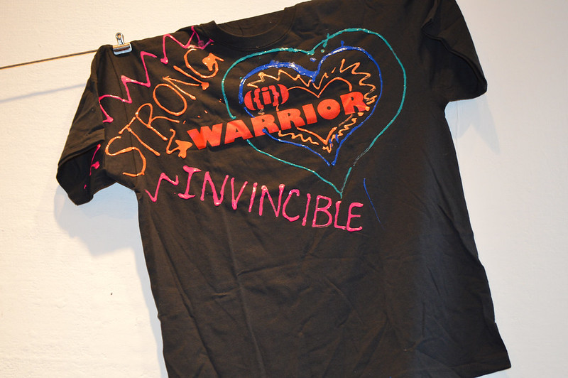 t-shirt with painted words: strong, warrior and invincible